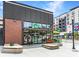 Wahlburgers restaurant with a modern glass facade and outdoor seating at 3901 Old Atlanta Station Se Dr, Atlanta, GA 30339