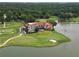 Stunning aerial view of the house, golf course, and lake, offering a serene and picturesque setting at 453 Carter Se Ave, Atlanta, GA 30317