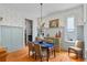 Dining room features hardwood floors, decorative wainscoting, and elegant chandelier at 453 Carter Se Ave, Atlanta, GA 30317