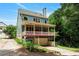 Multi-story home with a rear deck, a two-car garage, and a beautifully landscaped yard at 453 Carter Se Ave, Atlanta, GA 30317