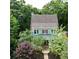 An aerial view highlights the exterior of a charming house with a lovely porch and neatly landscaped surroundings at 453 Carter Se Ave, Atlanta, GA 30317