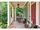 Inviting front porch with rocking chair, lantern style lighting, and charming details at 453 Carter Se Ave, Atlanta, GA 30317