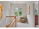 Bright hallway with a window and chair, featuring natural light and a cozy seating area at 453 Carter Se Ave, Atlanta, GA 30317