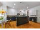 Spacious kitchen with white cabinets, granite countertops, and hardwood floors at 453 Carter Se Ave, Atlanta, GA 30317