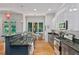 Stylish kitchen with granite countertops, stainless steel appliances, and adjacent breakfast area overlooking greenery at 453 Carter Se Ave, Atlanta, GA 30317
