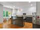Well-lit kitchen featuring stainless steel appliances, granite countertops, and breakfast nook with natural light at 453 Carter Se Ave, Atlanta, GA 30317