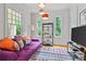 Bright living room with colorful decor, large windows, and modern furnishings at 453 Carter Se Ave, Atlanta, GA 30317
