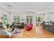 Open-concept living area with a fireplace, hardwood floors, and seamless flow to the kitchen and dining space at 453 Carter Se Ave, Atlanta, GA 30317
