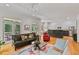 Bright open living room featuring hardwood floors, modern lighting, and access to outdoor patio at 453 Carter Se Ave, Atlanta, GA 30317
