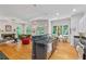 Open-concept living space with kitchen, dining, and living areas featuring modern appliances and hardwood floors at 453 Carter Se Ave, Atlanta, GA 30317