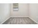 Cozy bedroom with neutral walls, a window and soft gray carpeting at 211 Margaret St, Fairburn, GA 30213