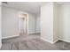 Hallway with neutral walls, and soft gray carpeting at 211 Margaret St, Fairburn, GA 30213