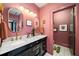 Stylish bathroom with a double sink vanity, gold fixtures, and a unique 'Get Naked' bathmat at 486 Haas Se Ave, Atlanta, GA 30316