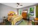 Cozy bedroom with hardwood floors, large windows offering an abundance of natural light, and unique decorations at 486 Haas Se Ave, Atlanta, GA 30316