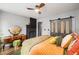 Inviting bedroom featuring a decorative fireplace, a stylish vanity, and sliding barn doors at 486 Haas Se Ave, Atlanta, GA 30316