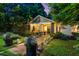 Charming home exterior with manicured lawn, elegant landscaping, and walkway lighting at 486 Haas Se Ave, Atlanta, GA 30316
