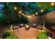Backyard fire pit area with comfortable seating, ambient lighting, and tasteful decor for outdoor evenings at 486 Haas Se Ave, Atlanta, GA 30316