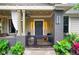 View of a cozy front porch with a swing, string lights, and stylish accents, perfect for relaxation at 486 Haas Se Ave, Atlanta, GA 30316