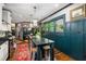 Updated kitchen boasts a central island, granite countertops, stainless steel appliances, and stylish pendant lighting at 486 Haas Se Ave, Atlanta, GA 30316