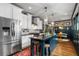 Spacious kitchen featuring a large island, stainless steel appliances, and elegant pendant lighting at 486 Haas Se Ave, Atlanta, GA 30316