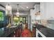 Well-appointed kitchen with stainless steel appliances, black countertops, and white cabinets, offering style and functionality at 486 Haas Se Ave, Atlanta, GA 30316