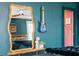 Stylish main bedroom featuring dark blue walls, hardwood floors, ceiling fan, and a cozy, inviting atmosphere at 486 Haas Se Ave, Atlanta, GA 30316