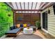 Relaxing outdoor area with a covered structure, comfortable seating, and a view of the surrounding trees at 486 Haas Se Ave, Atlanta, GA 30316