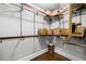 Walk-in closet with custom shelving, hanging rods, and ample storage space for organization and convenience at 486 Haas Se Ave, Atlanta, GA 30316