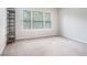 Neutral bedroom featuring large windows and plush carpet at 85 Brushed Ives Ct, Lawrenceville, GA 30045