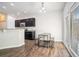 Bright dining area with stainless steel appliances, granite countertops, and a view of the backyard at 85 Brushed Ives Ct, Lawrenceville, GA 30045