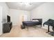 Carpeted main bedroom featuring lots of natural light and closet space at 85 Brushed Ives Ct, Lawrenceville, GA 30045