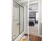 Modern bathroom offering a glass door shower and open access to the main bedroom suite at 901 Winfield Se Ave, Atlanta, GA 30316