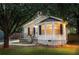 Charming home with a well-manicured lawn, bay windows, and covered front porch seating area at 901 Winfield Se Ave, Atlanta, GA 30316