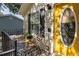 Close-up view of front porch with stylish decor and inviting yellow door, creating a warm welcome at 901 Winfield Se Ave, Atlanta, GA 30316