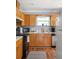 Functional kitchen with oak cabinets, laminate countertops, and essential appliances at 901 Winfield Se Ave, Atlanta, GA 30316