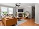 Inviting living room featuring a fireplace, stylish furnishings, hardwood floors, and large windows at 901 Winfield Se Ave, Atlanta, GA 30316