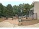 Enclosed backyard features a wrought iron fence leading to a pool area and patio at 104 Hidden Springs Ln, Peachtree City, GA 30269