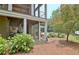 Backyard view of screened in porch, fan, and yard area at 104 Hidden Springs Ln, Peachtree City, GA 30269