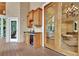 Covered deck with an outdoor kitchen with wine cooler, sink, and cabinets at 104 Hidden Springs Ln, Peachtree City, GA 30269