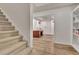 Finished basement featuring carpeted stairs, wood-look floors, an office and custom built-in shelving at 104 Hidden Springs Ln, Peachtree City, GA 30269
