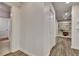 Hallway features new laminate flooring, new paint and built in shelving at 104 Hidden Springs Ln, Peachtree City, GA 30269