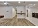 Finished basement with neutral paint, hard wood flooring and a bar area at 104 Hidden Springs Ln, Peachtree City, GA 30269