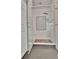 Bathroom showcasing a glass-enclosed shower with a tiled bench and fixtures at 104 Hidden Springs Ln, Peachtree City, GA 30269