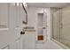 Remodeled bathroom features new vanity, a glass shower and wood look tile at 104 Hidden Springs Ln, Peachtree City, GA 30269