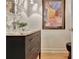 Stylish half-bath with a modern vanity, granite counter and ornate mirror at 104 Hidden Springs Ln, Peachtree City, GA 30269