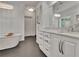 Bathroom boasting a freestanding tub, white cabinets, and a stunning chandelier at 104 Hidden Springs Ln, Peachtree City, GA 30269