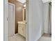 Bathroom featuring cream colored vanity with white countertop and tile flooring at 104 Hidden Springs Ln, Peachtree City, GA 30269