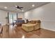 Bedroom features hardwood floors, a ceiling fan and a comfy seating area at 104 Hidden Springs Ln, Peachtree City, GA 30269