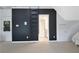 Dark accent wall featuring ladder and doorway to bathroom; features additional closet at 104 Hidden Springs Ln, Peachtree City, GA 30269
