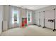 Spacious walk-in closet with natural light, two clothing racks, and colorful cube shelving at 104 Hidden Springs Ln, Peachtree City, GA 30269